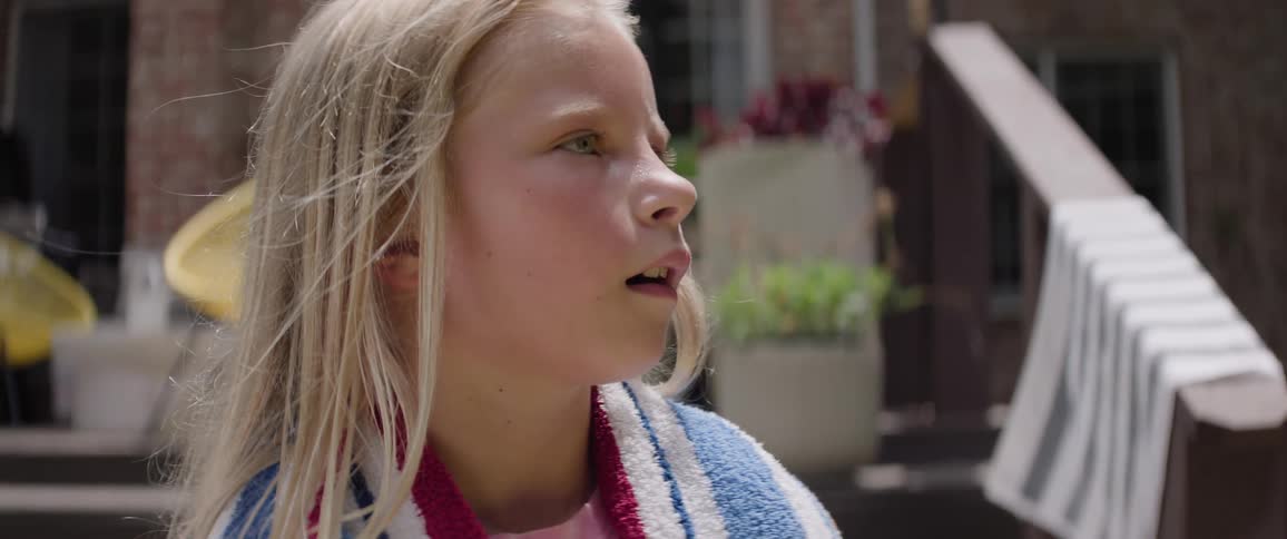 Children in a backyard looking with a surprised face