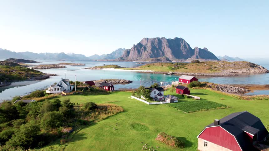 Village in a seaside area with mountains in the background