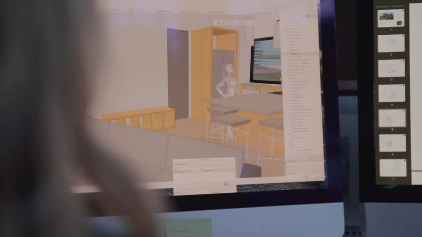 A woman is using software on the computer