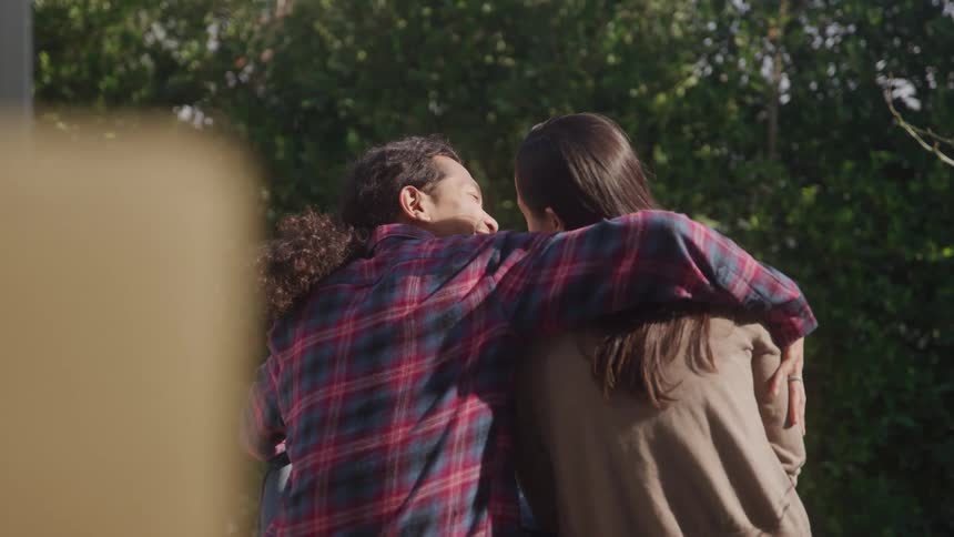 Couple outdoors hugging