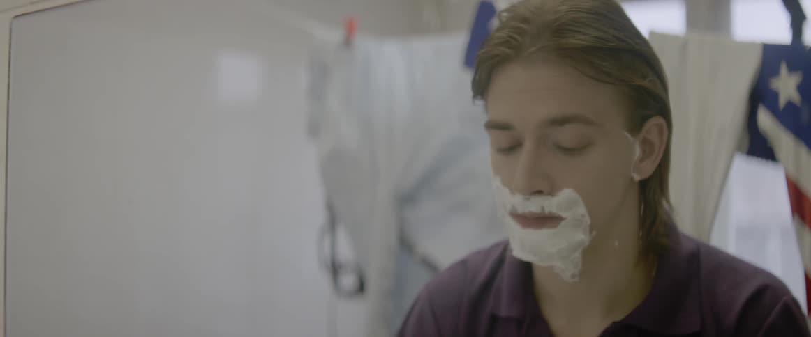 A man shaves his face