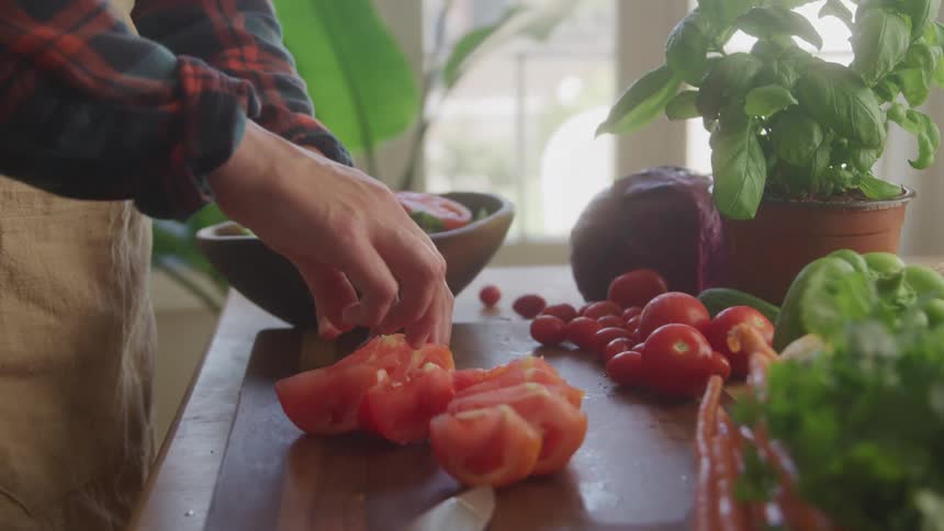 A person makes a salad