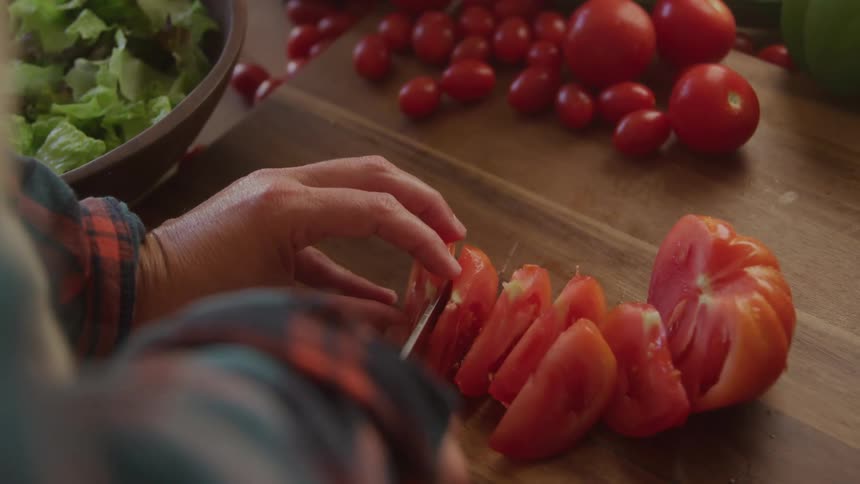 A tomato is sliced up