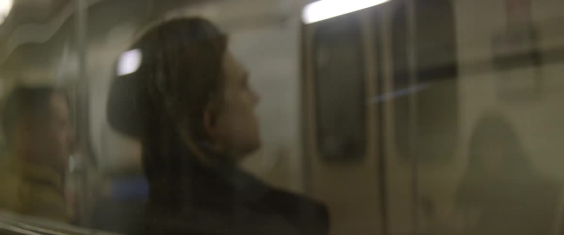 A man rides a subway train