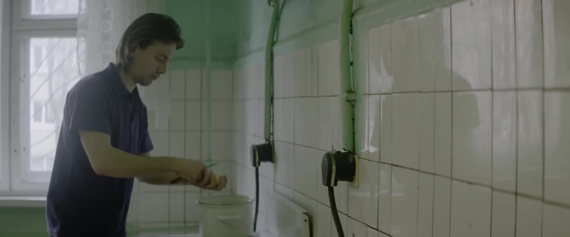 A man is peeling a potato