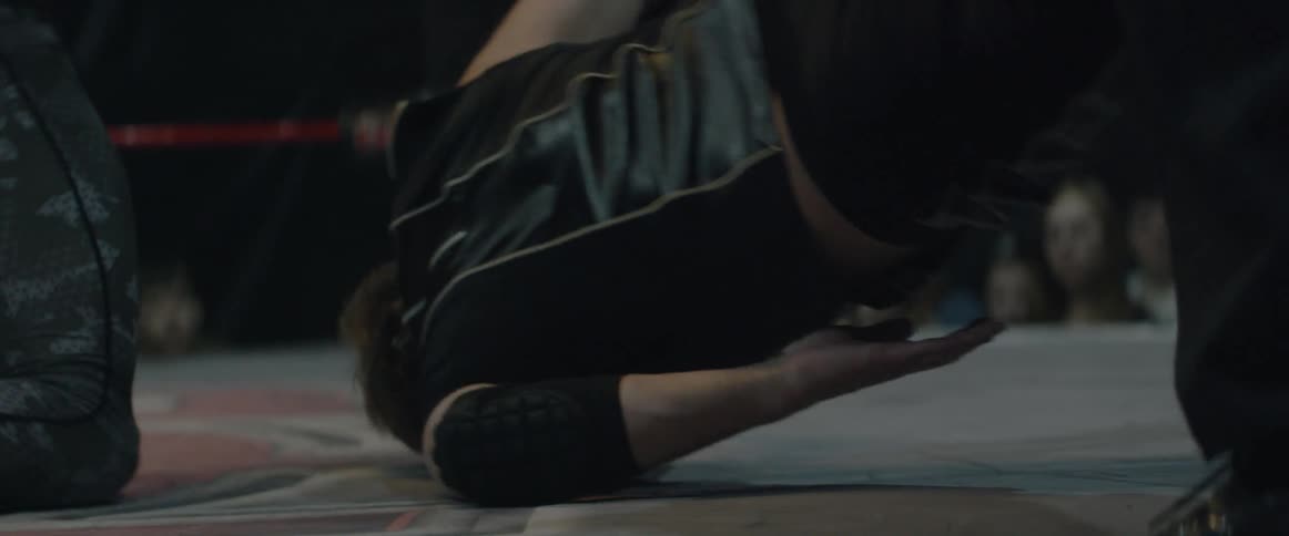 A wrestler is smashed into the ring