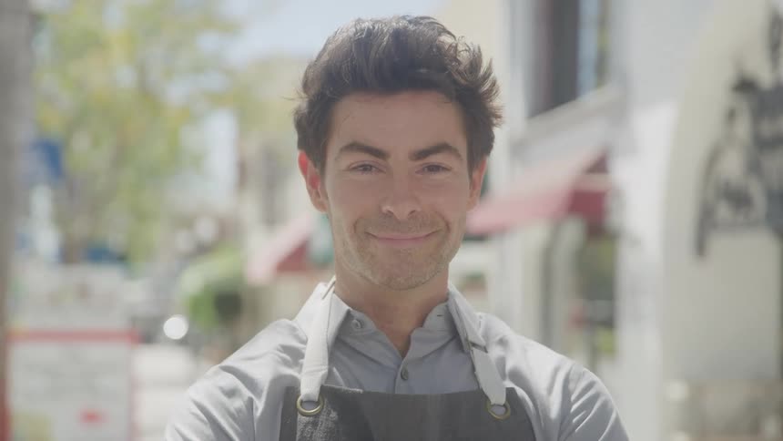 Chef in apron outdoors