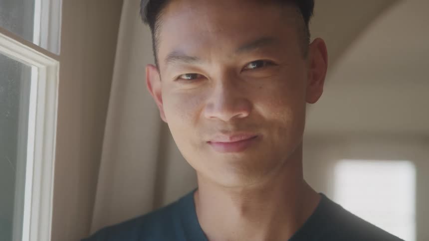 The man is smiling at home