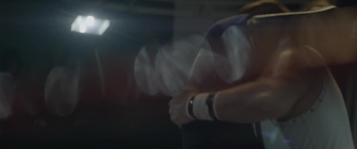 Two wrestlers are fighting in a wrestling ring