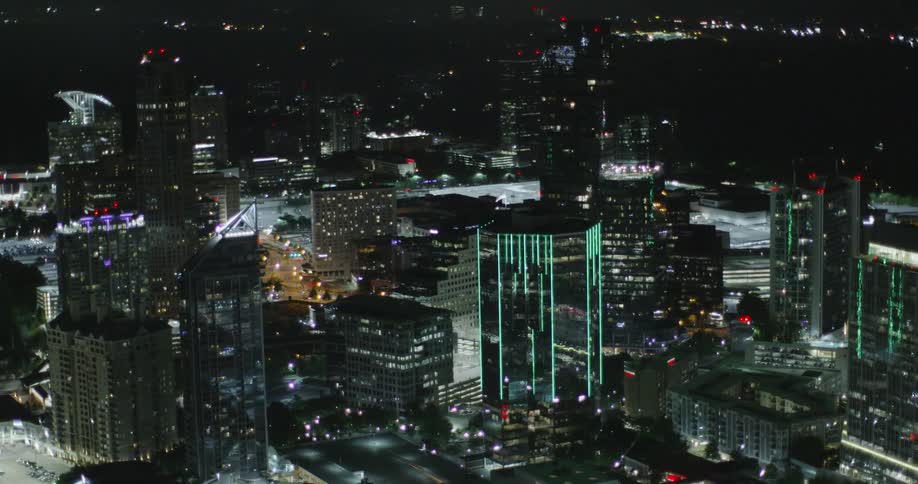 A night view of a city with the buildings lit up