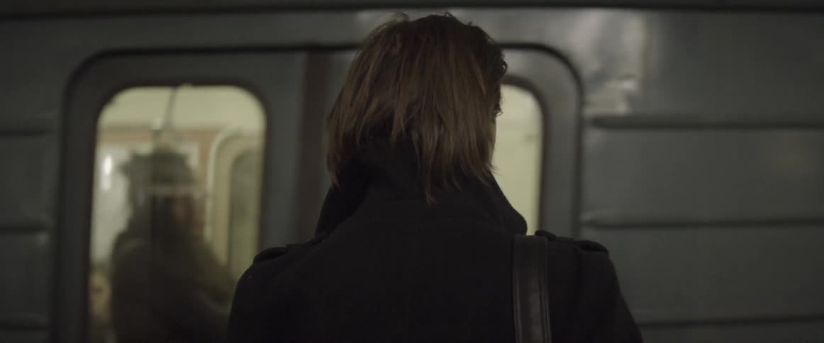A man waits for a subway train