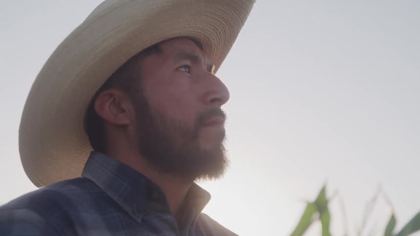 Close up portrait of a male farmer standing in a farm during daytime