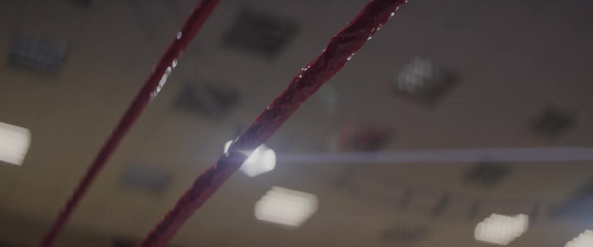 Wrestling ring ropes shake in a gymnasium
