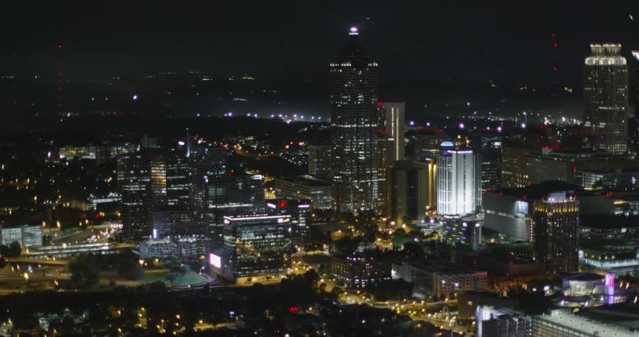A city skyline is lit up at night