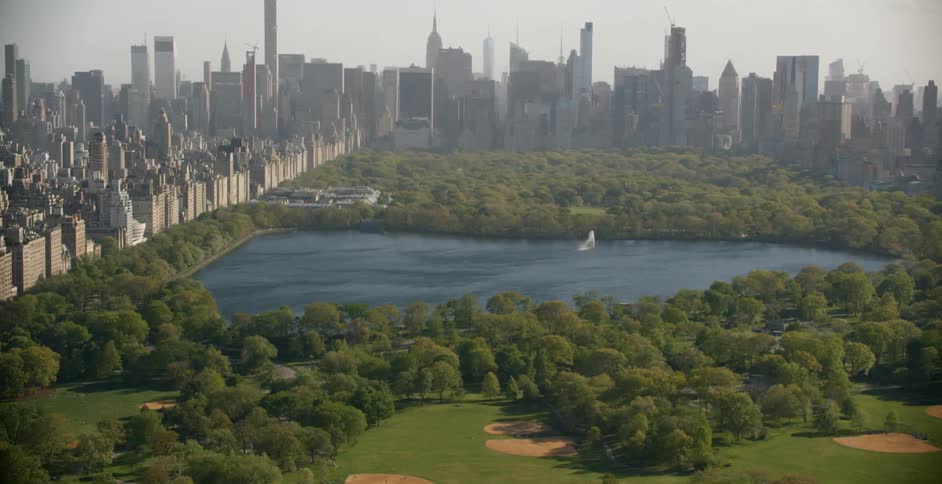 A view of city buildings as they reach central park