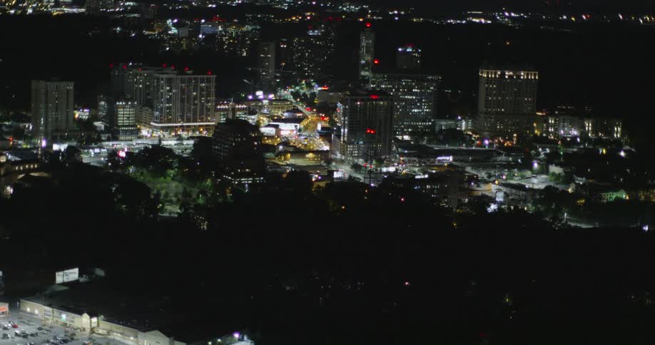 A city skyline is lit up at night
