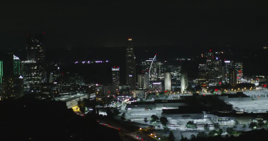 City buildings are shown at night