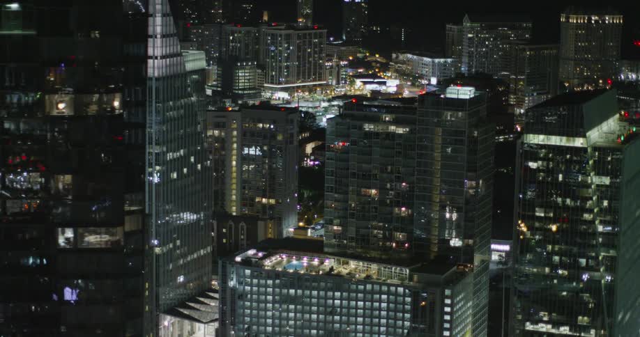 Many buildings are brightly lit at night