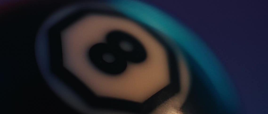 The eight ball is on the pool table