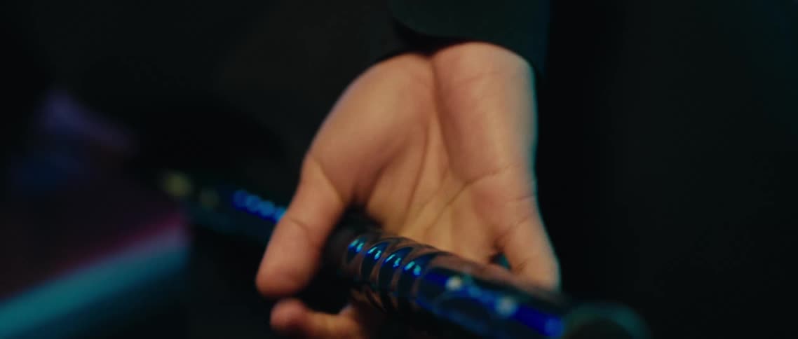 Pool player grips the cue while preparing to take a shot during a pool game