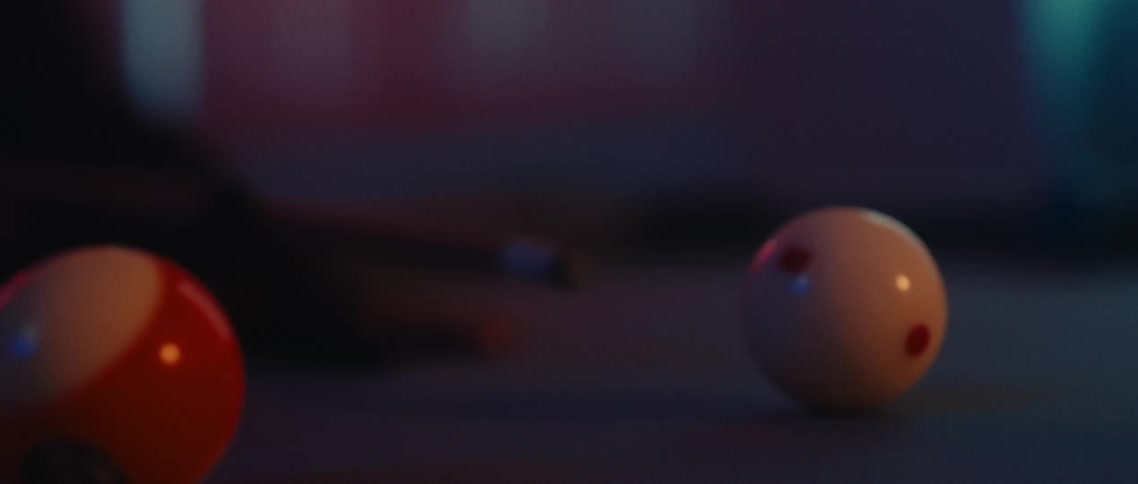 Silhouette of a person at a table playing pool