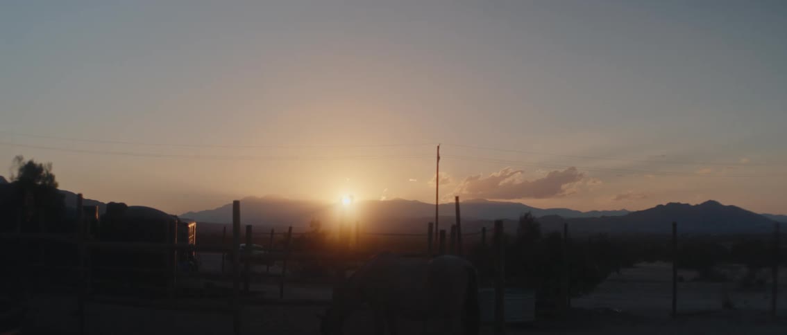The sun rises on the desert