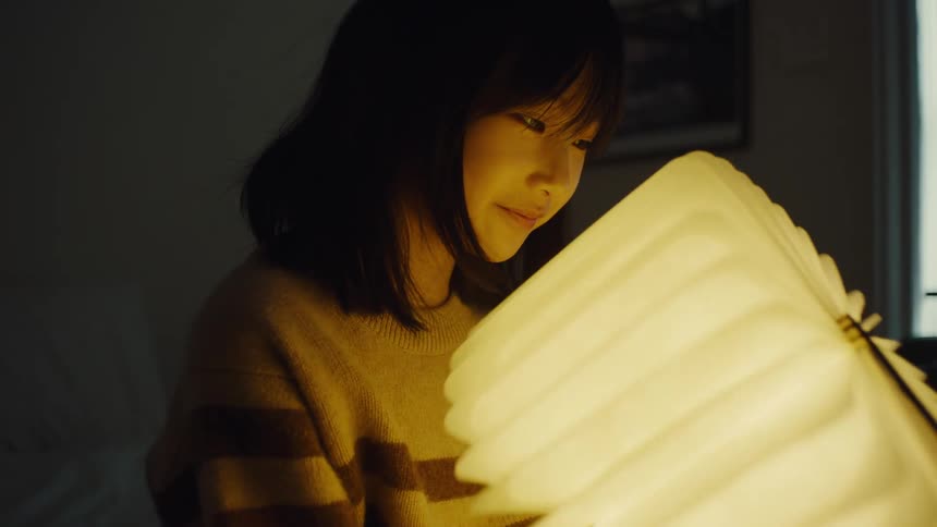 A child with a book that lights up when opened