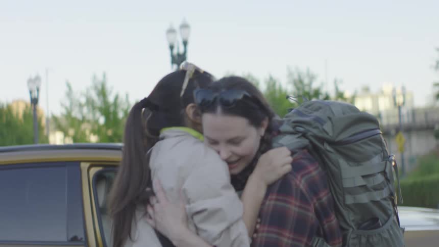 Three women embracing each other warmly