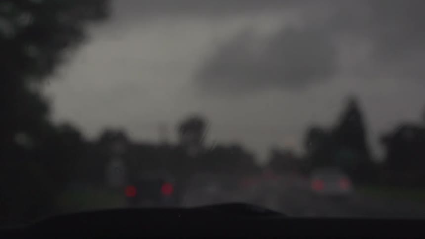 Windshield wipers on a rainy windshield