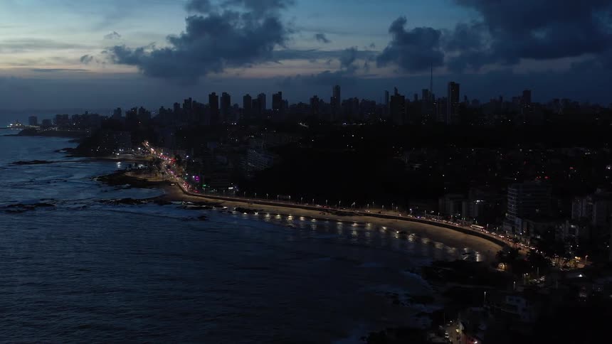 Aerial panorama of an urban city at dusk and the beachfront