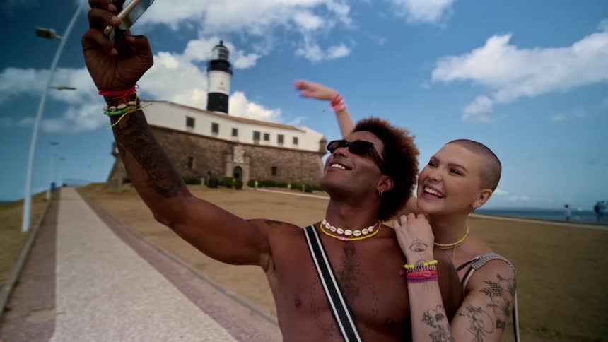 A couple take a selfie together on vacation