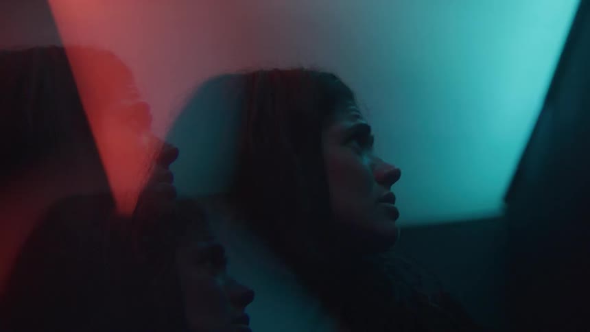 Woman in an environment with abstract lights
