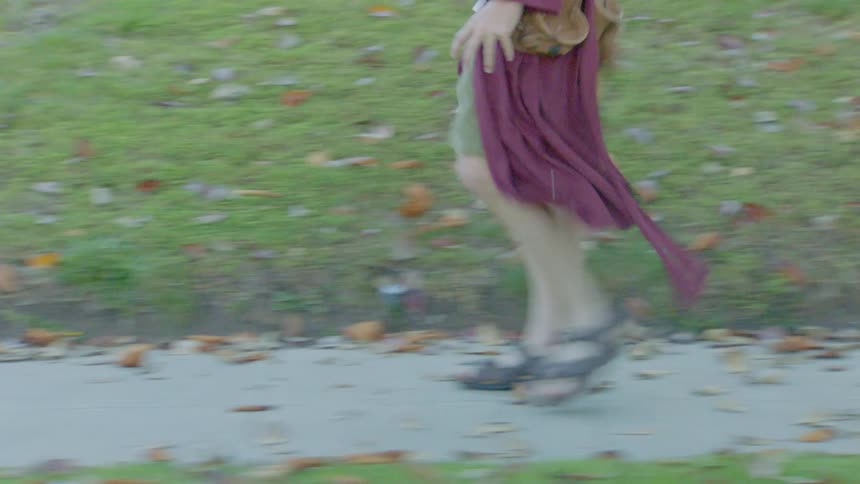 Person walking along a sidewalk