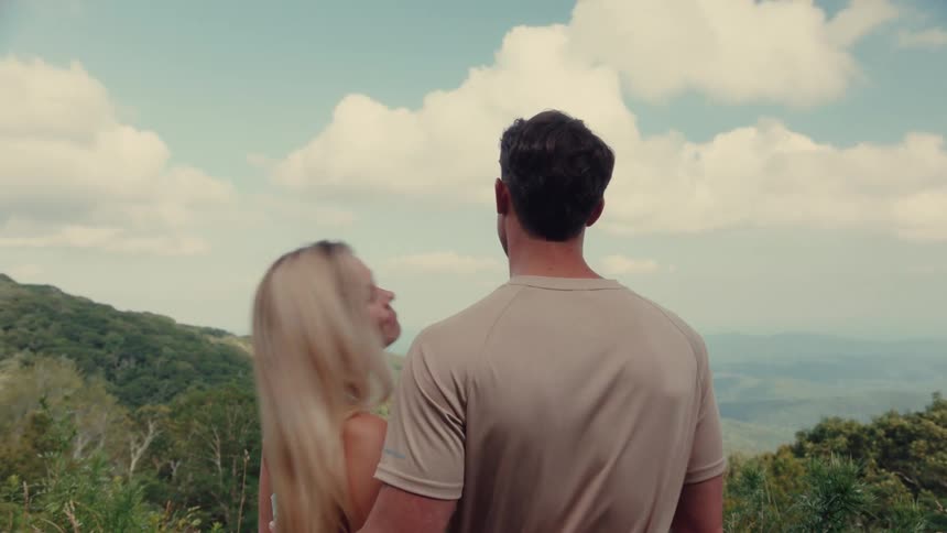 Couple hugging with natural mountain views
