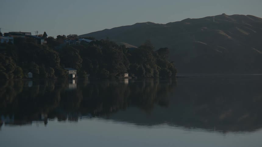 Landscape of a calm lake with mountains around
