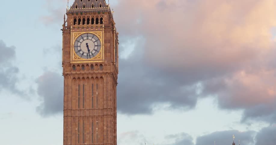 The video shows an upwardpanning shot of the elizabeth tower commonly known as big ben in london the clock towers ornate architecture is visible in detail with a large clock face at its center the sky is filled with dramatic cloudy formations