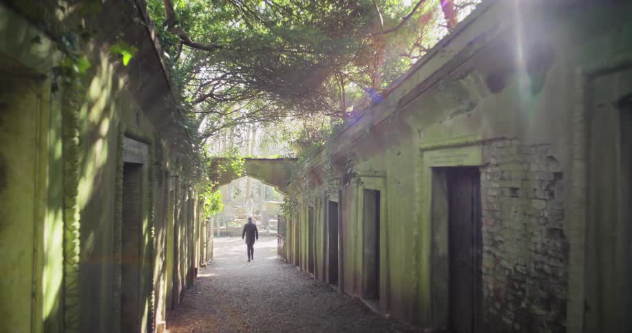 A man walks past a row of shelters