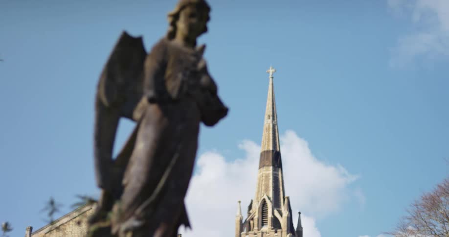 A statue is outside of the church