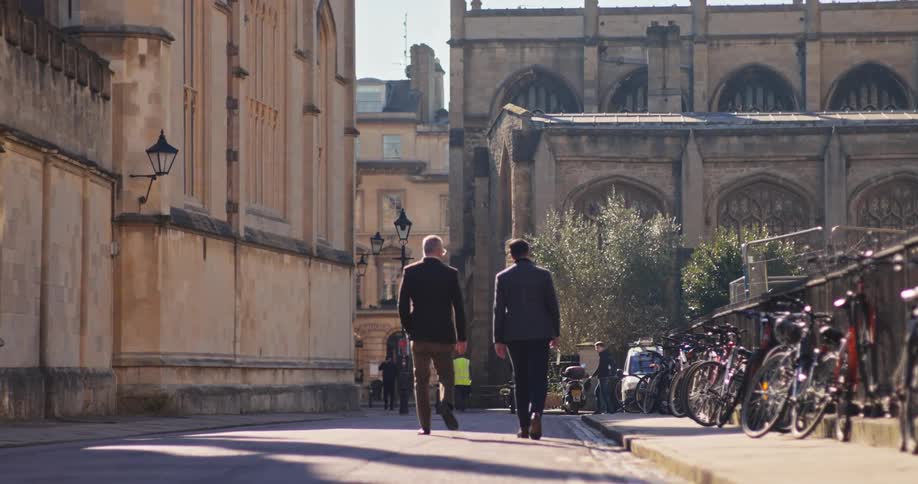 A couple men walking and talking