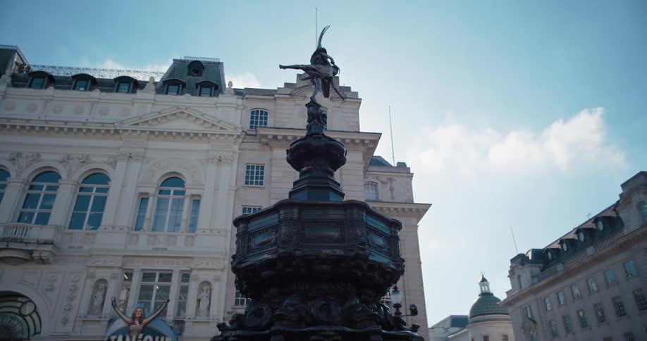 A tall fountain in a town square