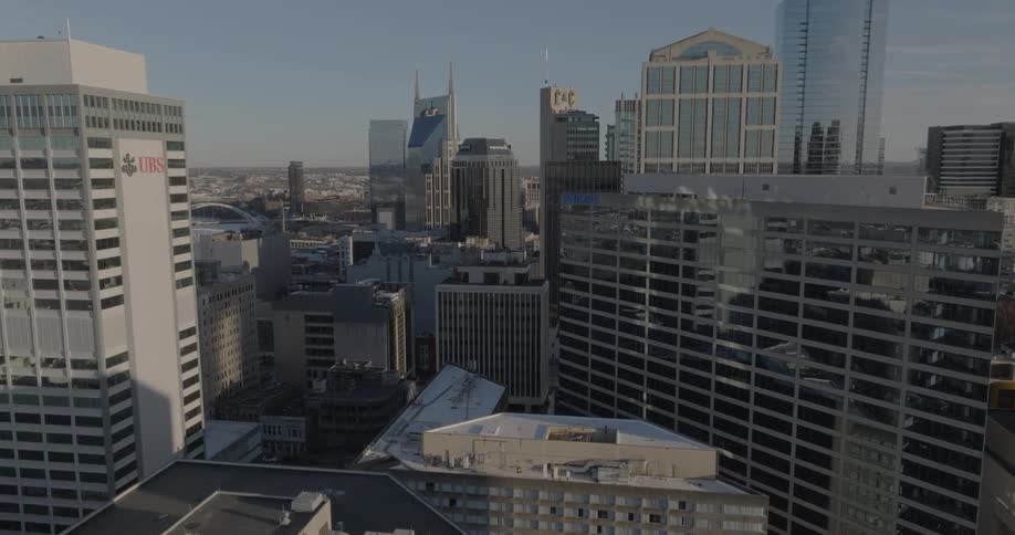 Windows on downtown skyscrapers reflect the nearby buildings during the daytime