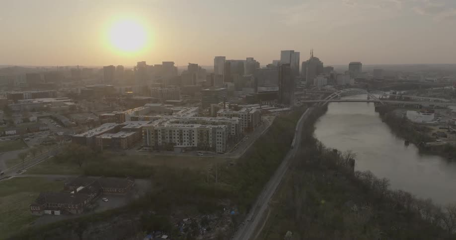 Aerial view of nashville at sunset with the cumberland river alongside