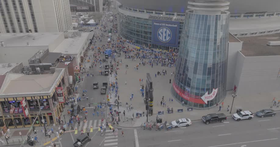 Crowd gathers in front of the arena with the sec logo prominently displayed