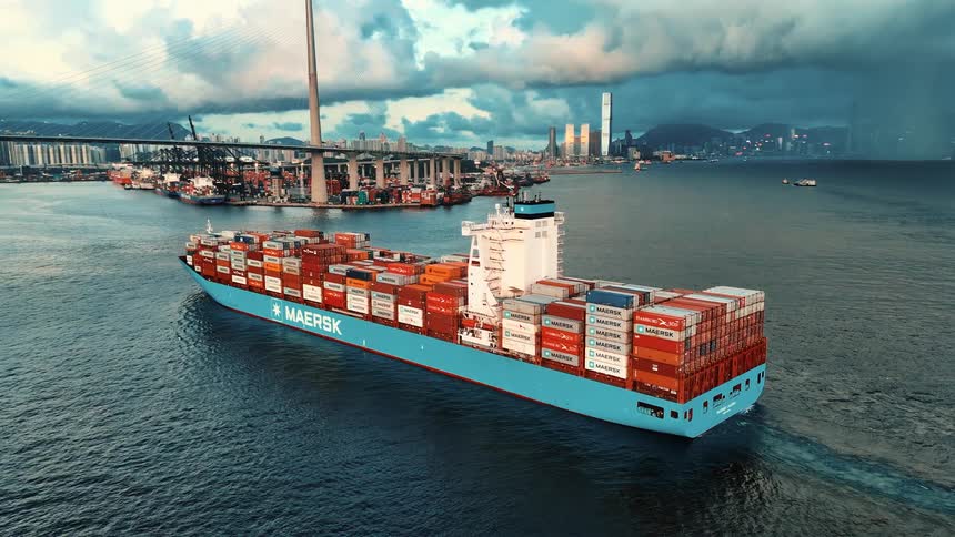 Cargo ship packed with containers heading towards port