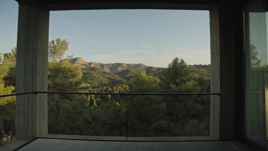 Scenic mountain and forest view framed by balcony