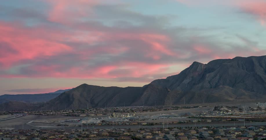 A large mountain towering over the suburbs