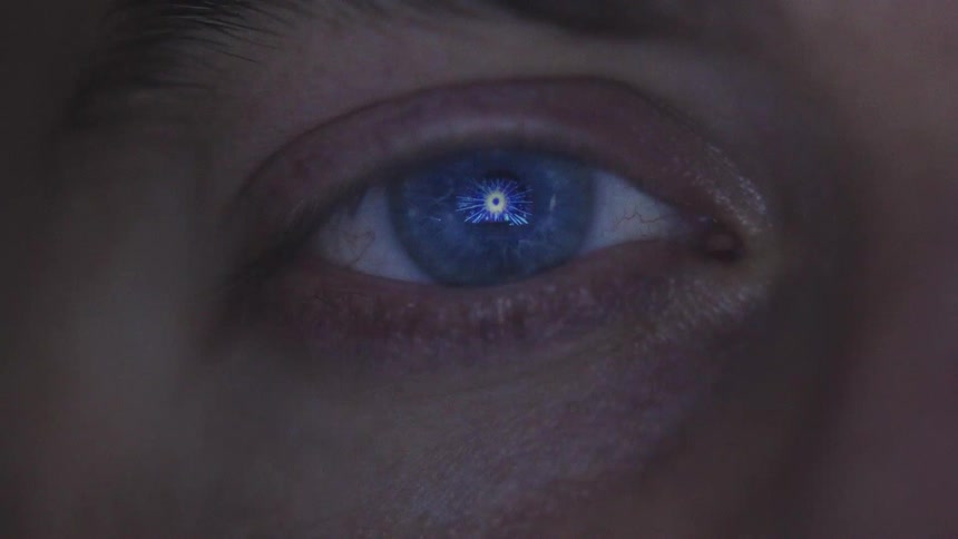 Human eye reflecting blue light