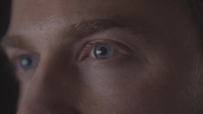 Closeup of a mans blue eyes