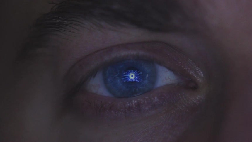 A man looks at a glowing object