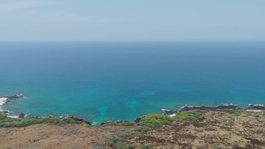 A coastal area with clear blue water